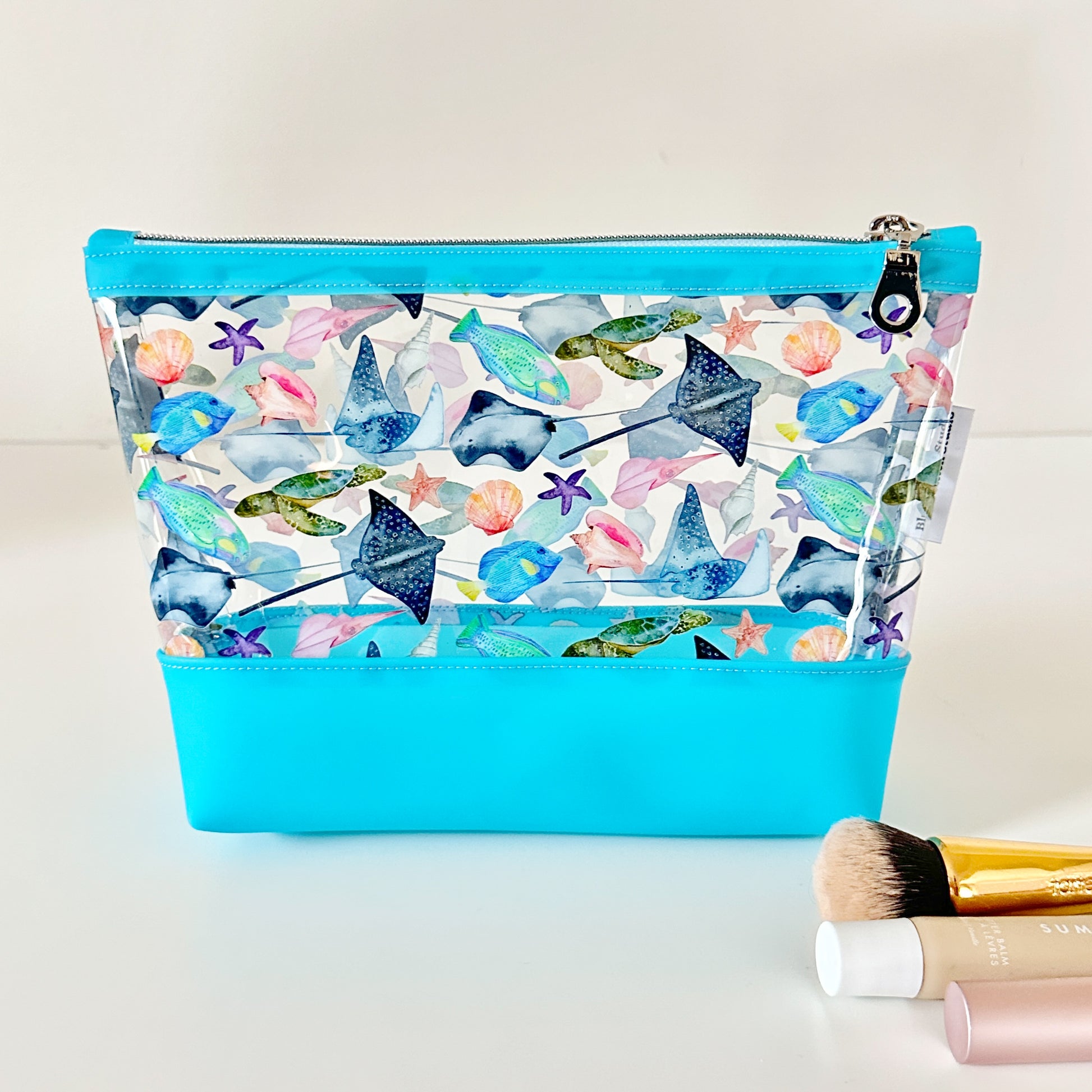clear makeup bag with a tropical fish and stingray pattern 