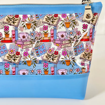 clear makeup bag with floral and book design