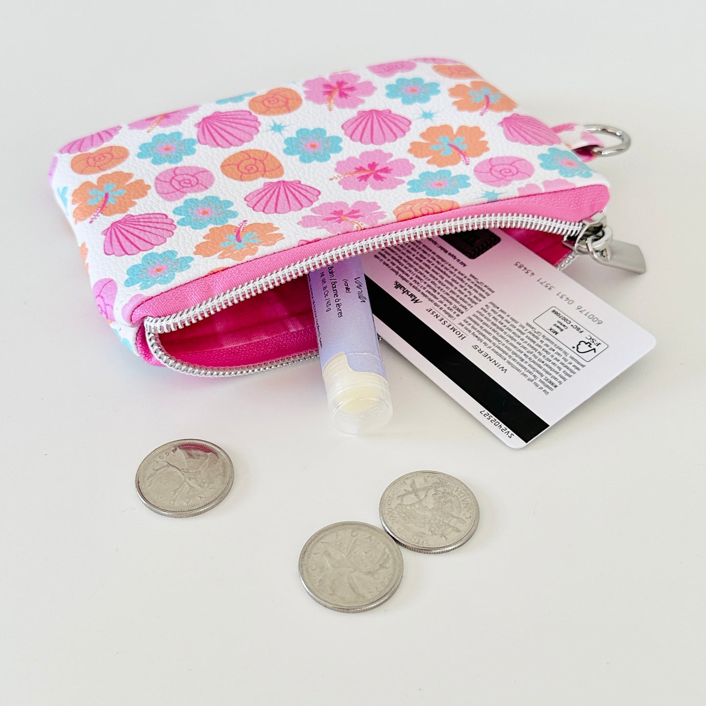 sea shell vegan leather coin purse with seashell pattern on a white background