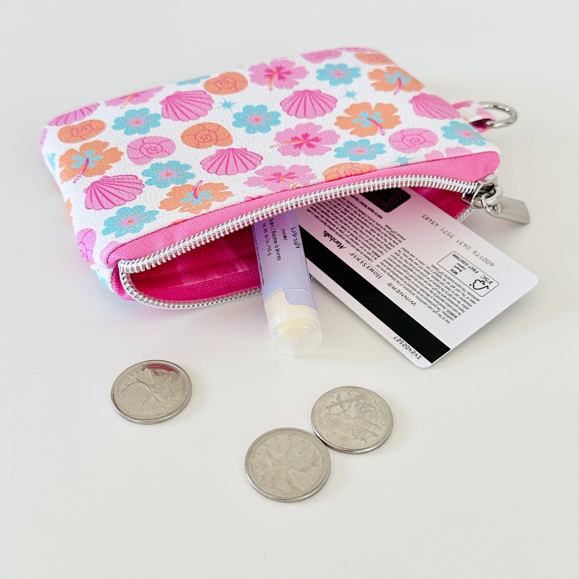 sea shell vegan leather coin purse with seashell pattern on a white background