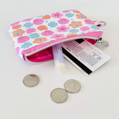 sea shell vegan leather coin purse with seashell pattern on a white background