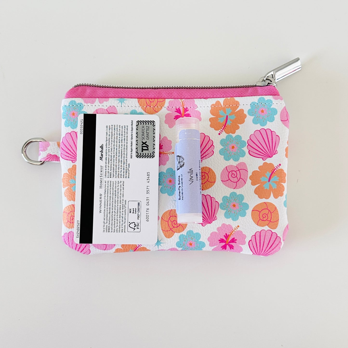 sea shell vegan leather coin purse with seashell pattern on a white background