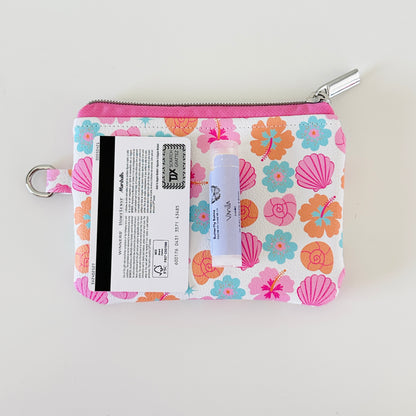 sea shell vegan leather coin purse with seashell pattern on a white background