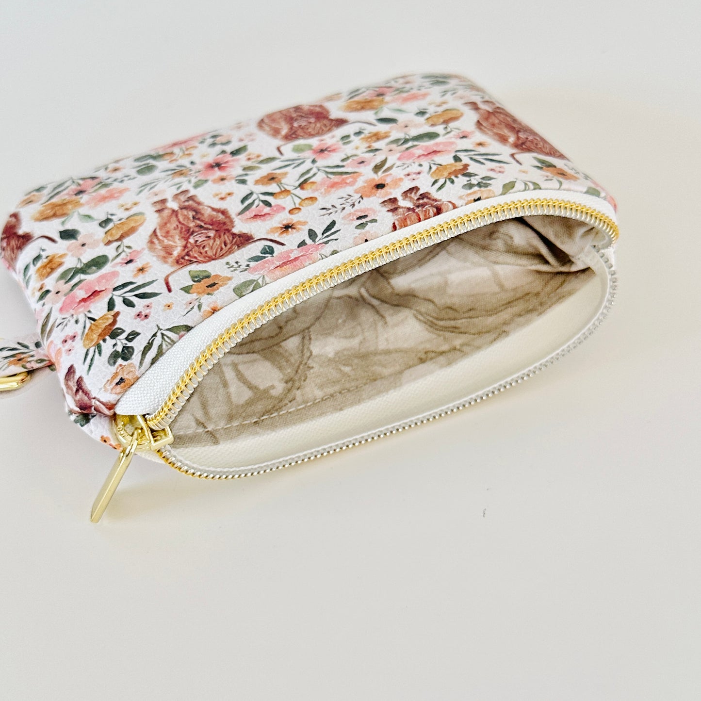white highland cow coin purse made from vegan leather. 