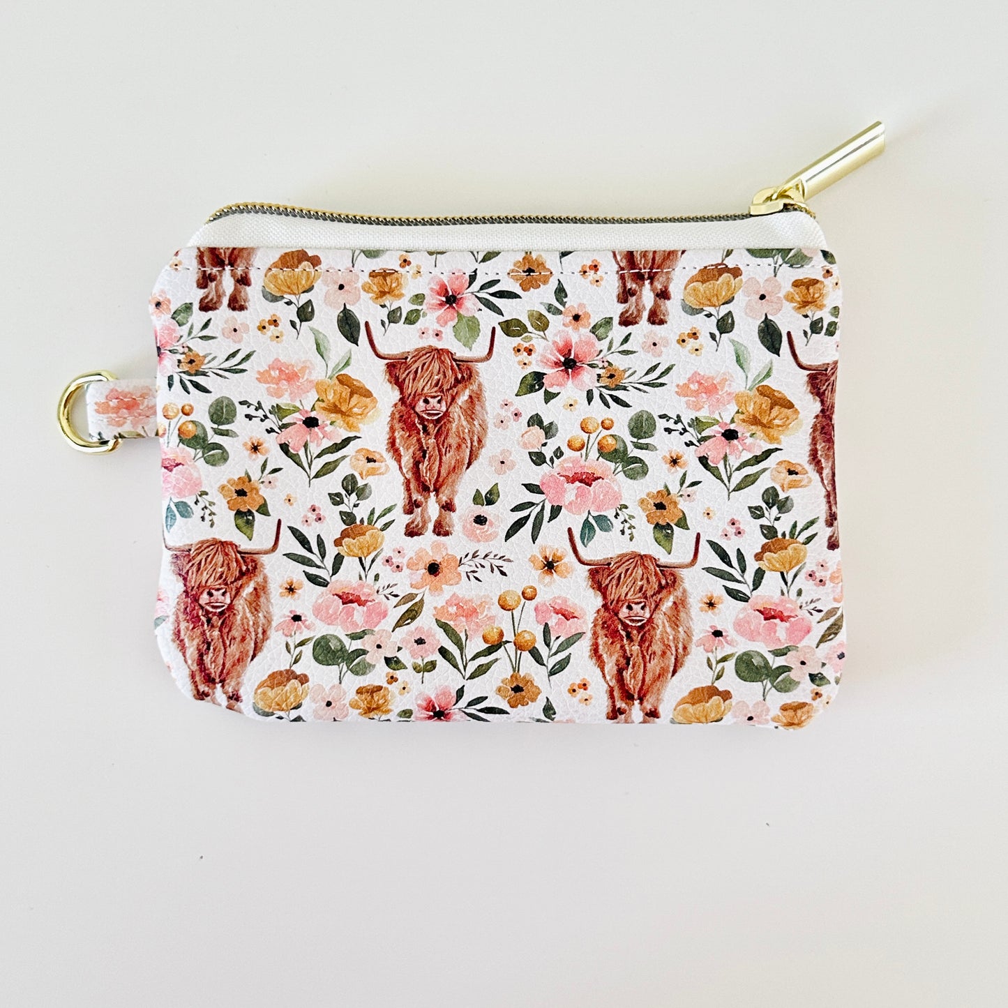 white highland cow coin purse made from vegan leather. 