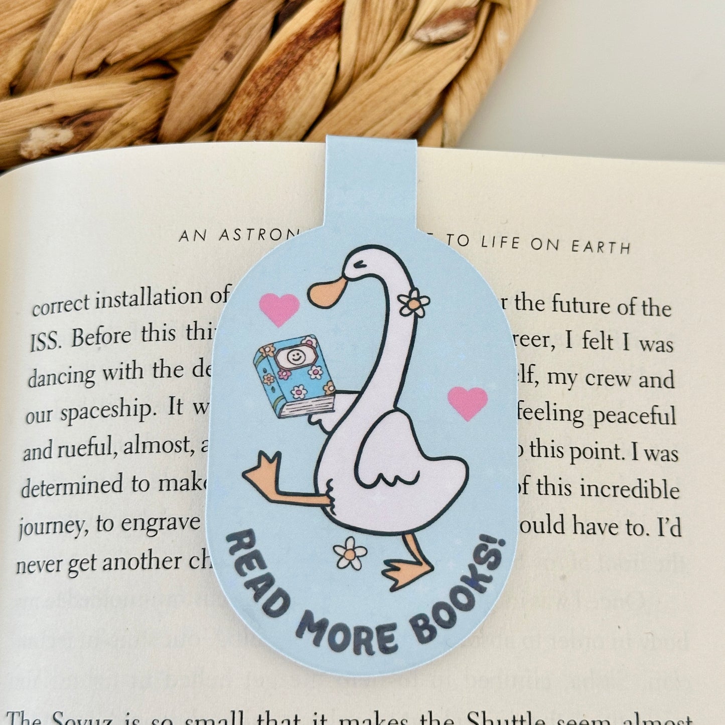 Bookmark with a goose holding a book and 'Read More Books!' text on an open book.