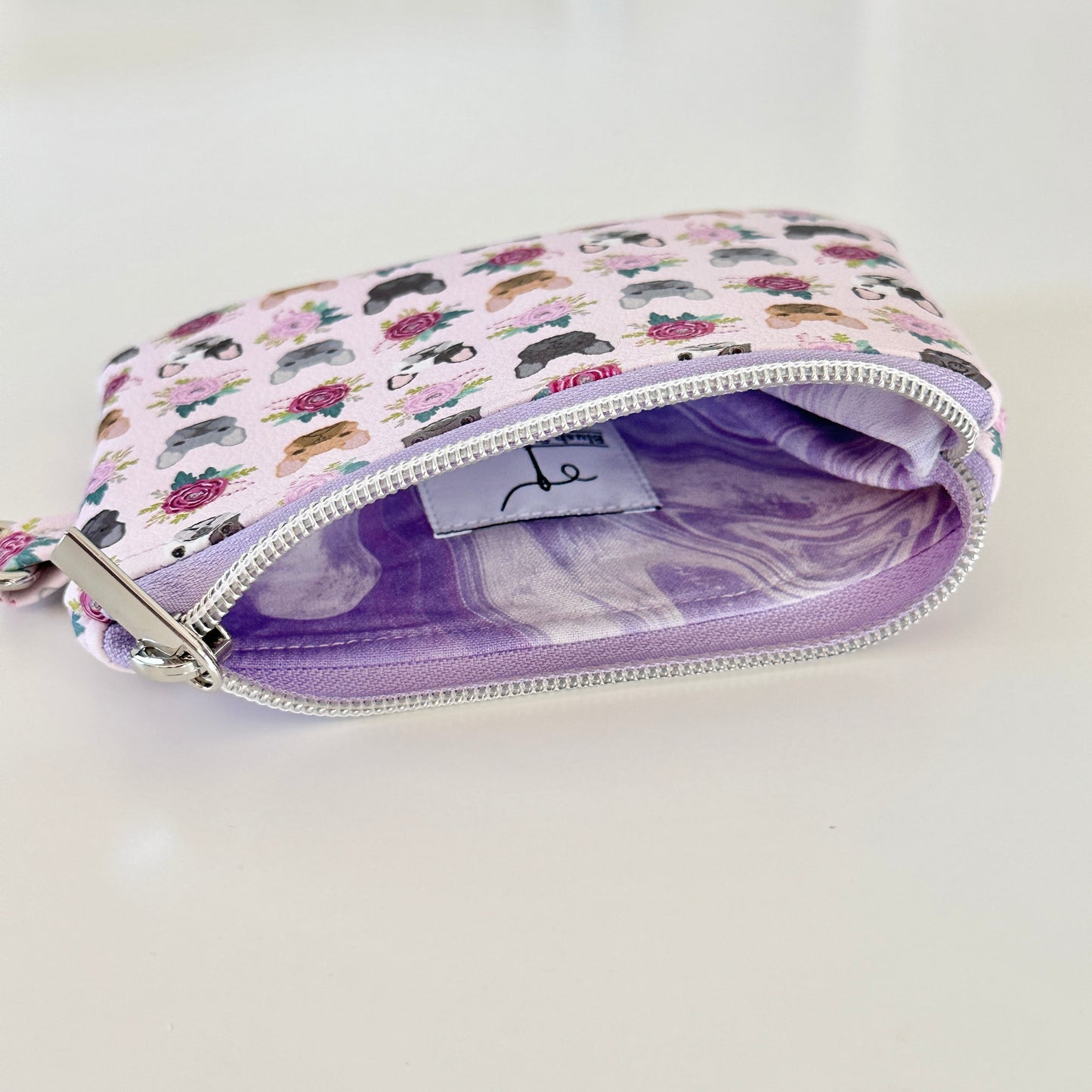 Small pouch with dog pattern on a white background