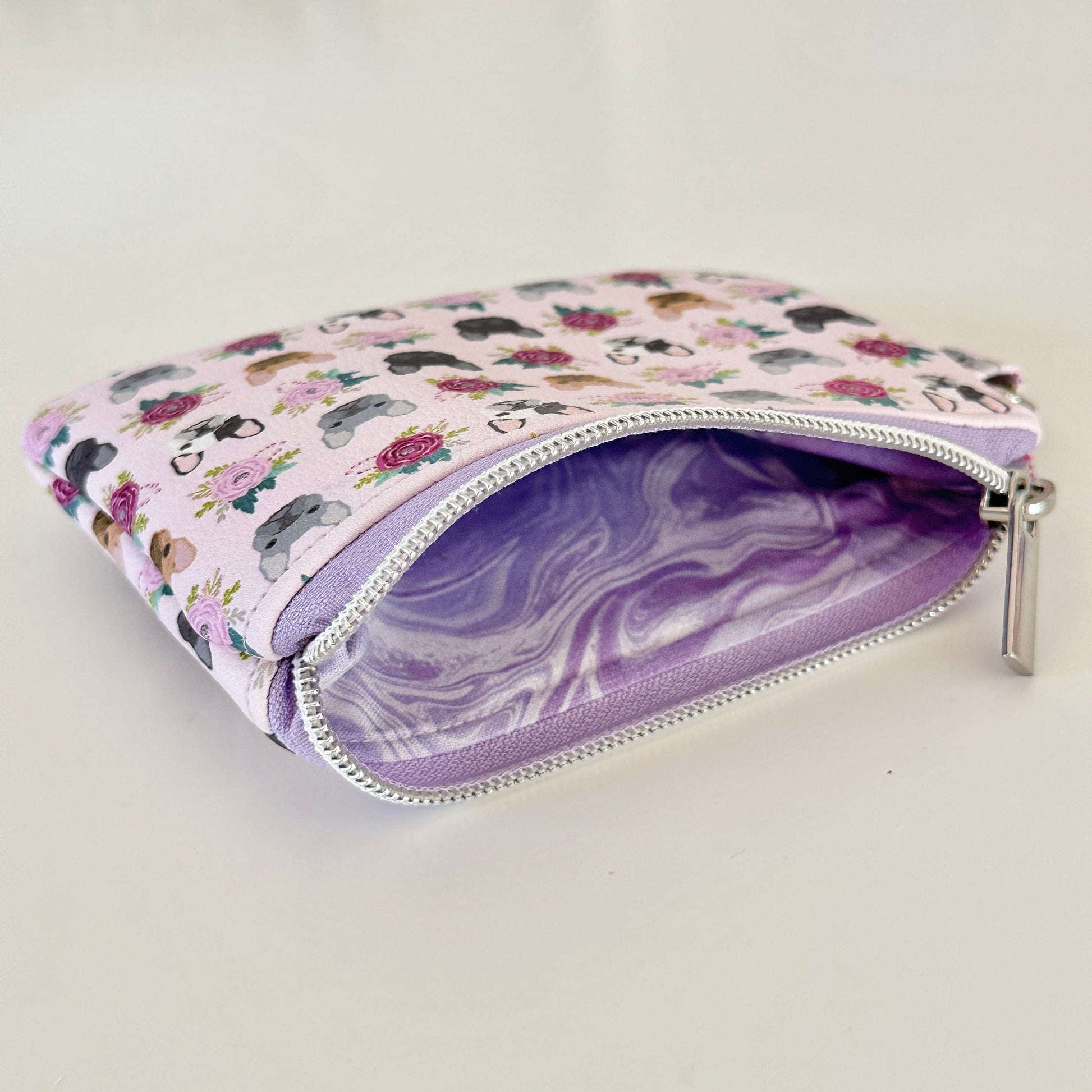Small pouch with dog pattern on a white background