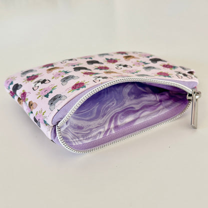 Small pouch with dog pattern on a white background