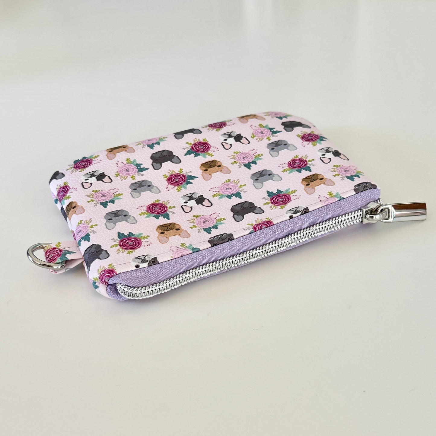 Small pouch with dog pattern on a white background