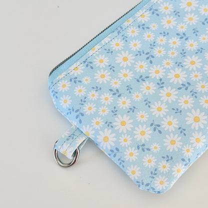 blue daisy Floral-patterned coin purse  with coins and cards on a light background