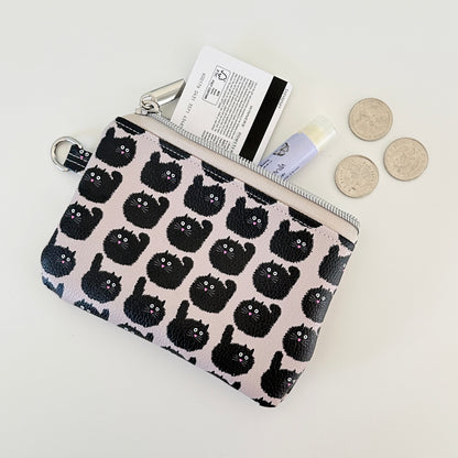 coin purse with a black cat pattern on a light background