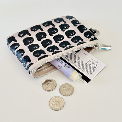 coin purse with a black cat pattern on a light background