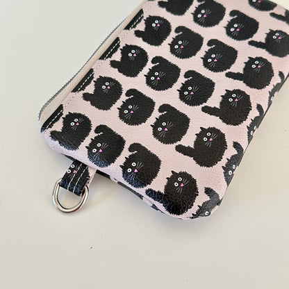 coin purse with a black cat pattern on a light background