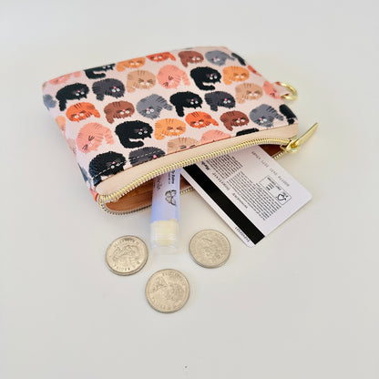 coin purse with a fluffy  cat pattern on a light background