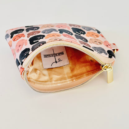 coin purse with a fluffy  cat pattern on a light background