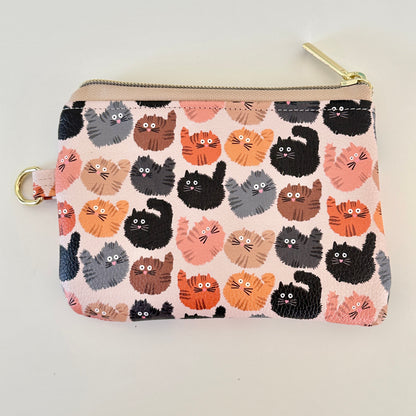coin purse with a fluffy  cat pattern on a light background