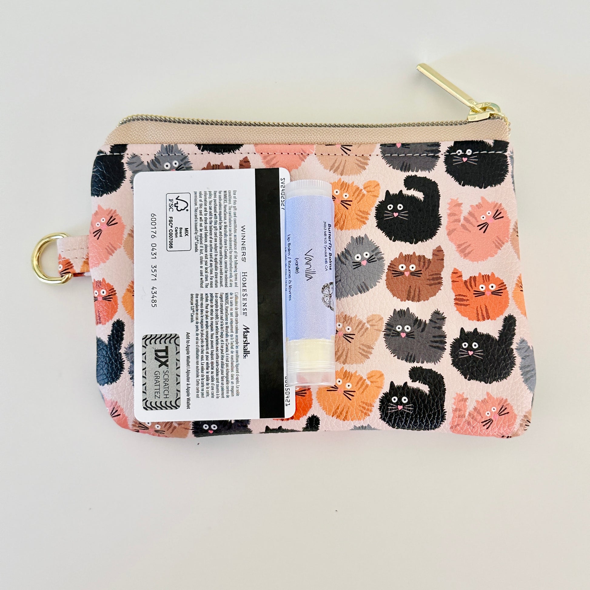 coin purse with a fluffy  cat pattern on a light background