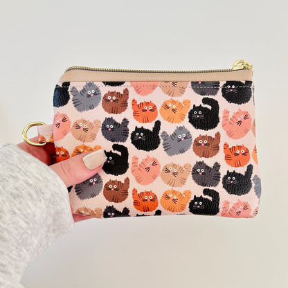 coin purse with a fluffy  cat pattern on a light background