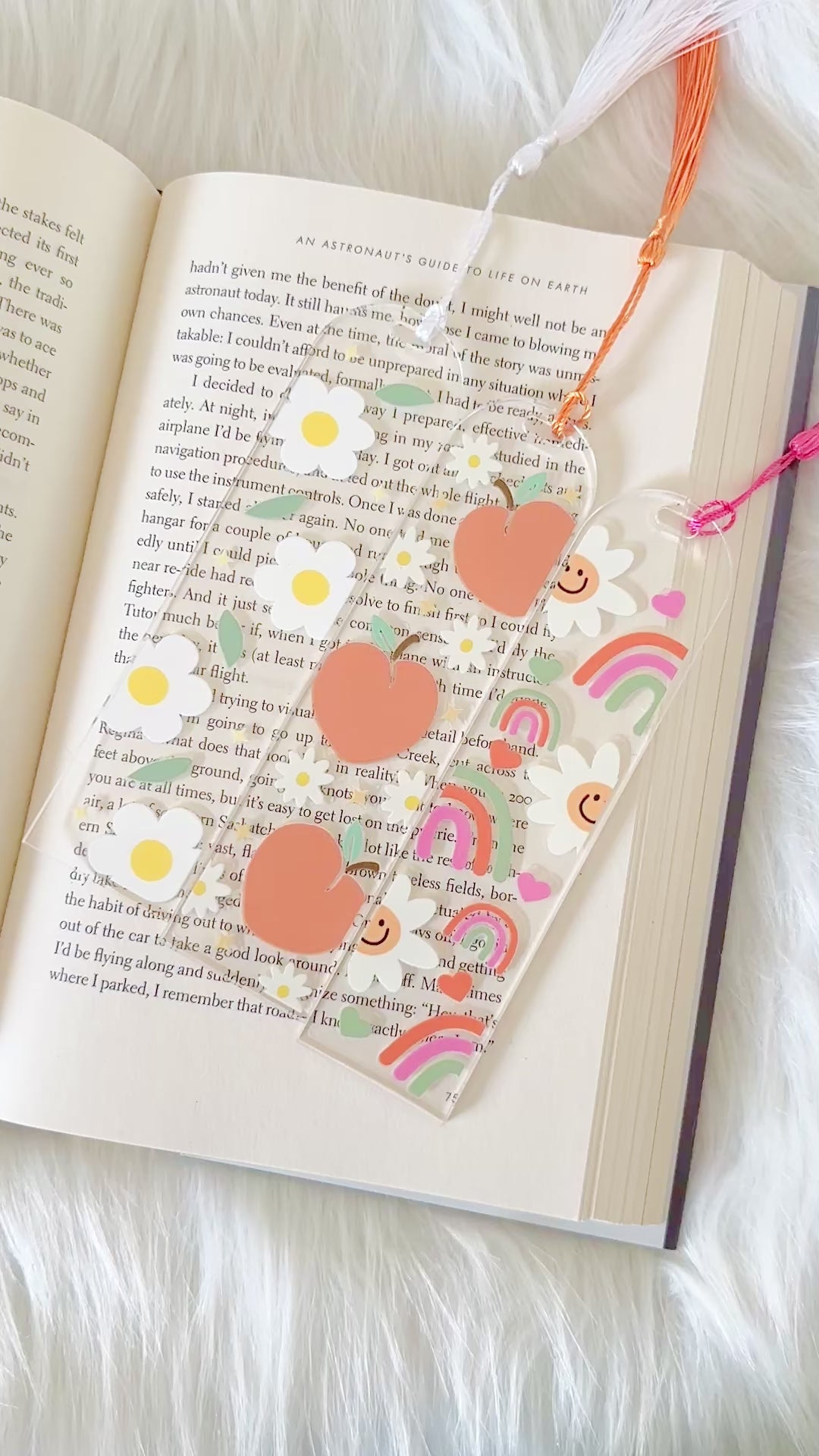 Decorative bookmark with heart designs on an open book