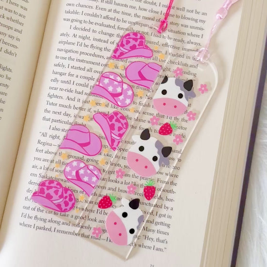Set of floral patterned keychains with gold clasps on a white background