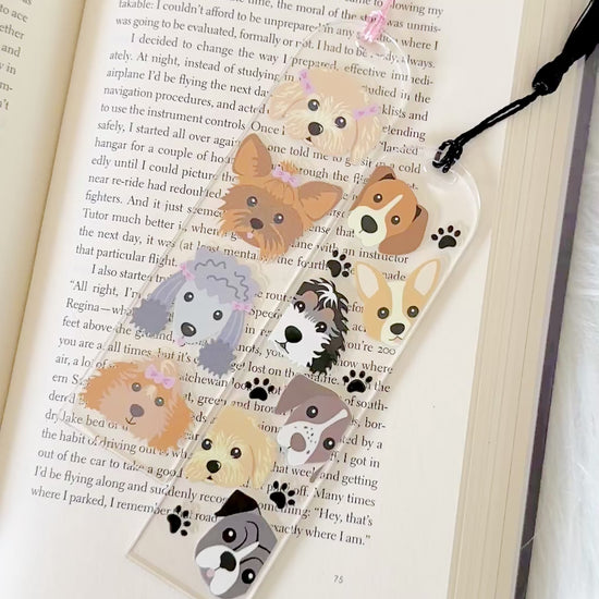 Bookmark with dog illustrations on a book page
