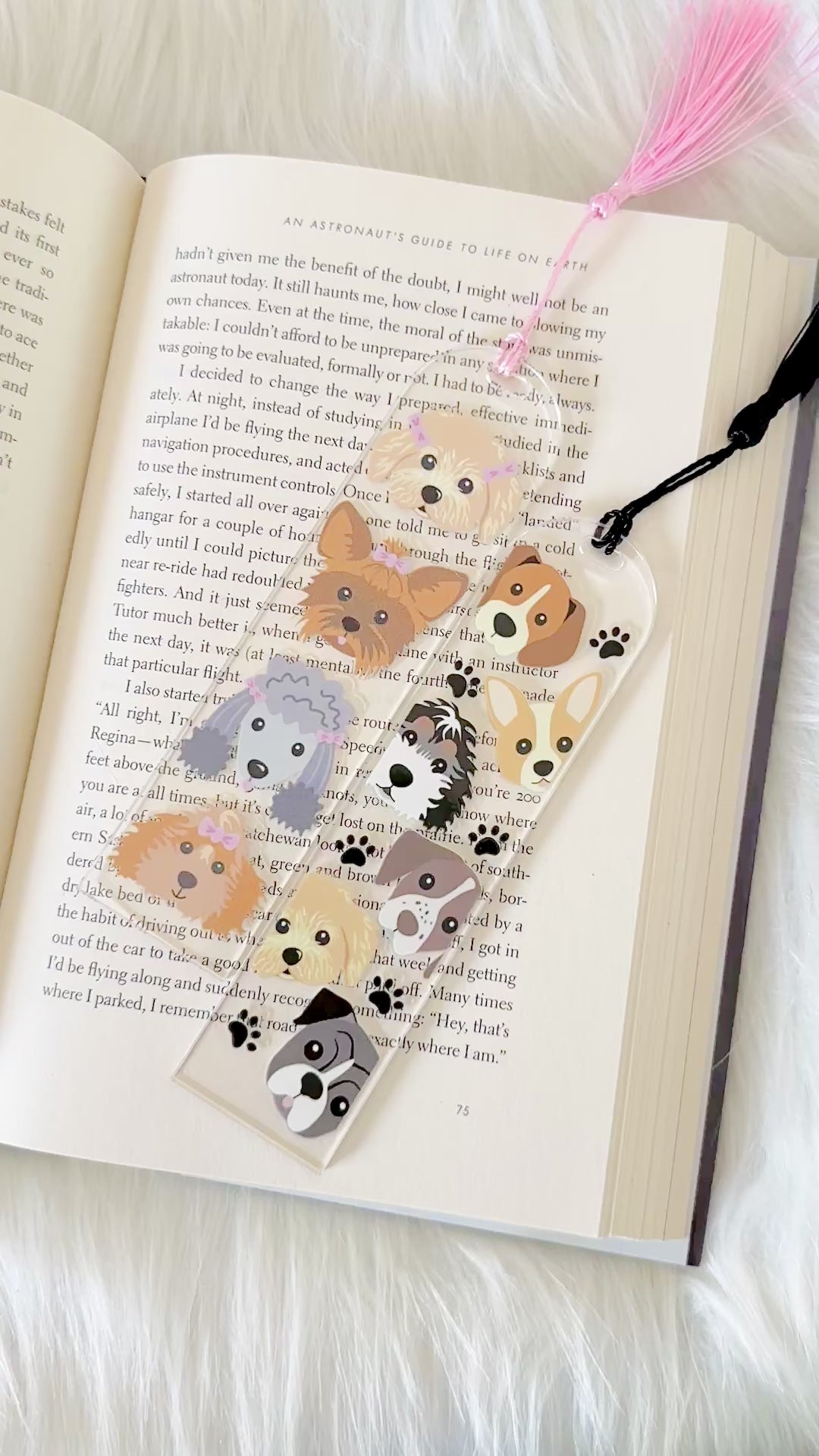 Bookmark with dog illustrations on a book page