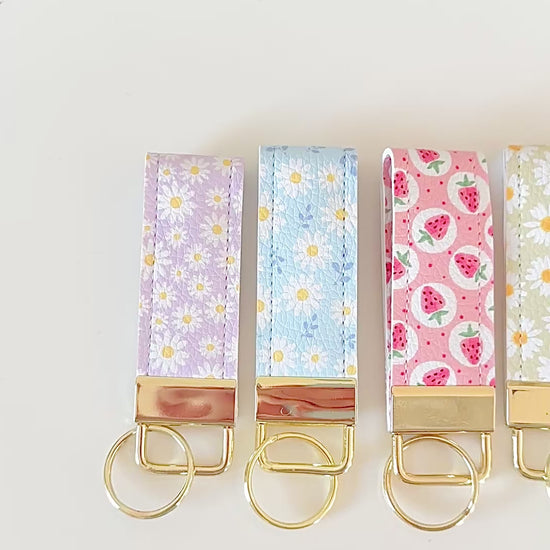 daisy floral and strawberry keychains with gold hardware