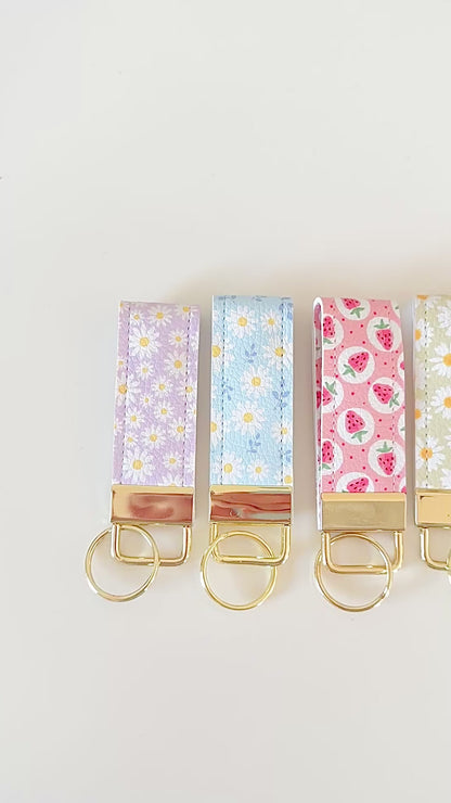 daisy floral and strawberry keychains with gold hardware