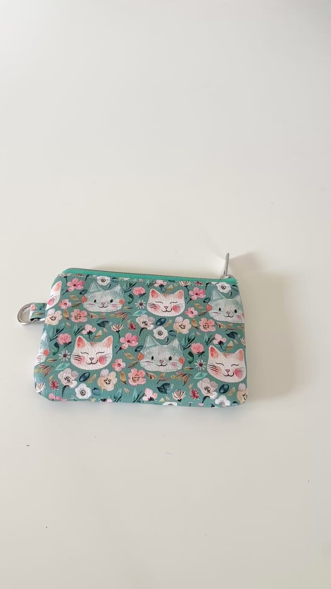 coin purse with cat and floral pattern on a white background