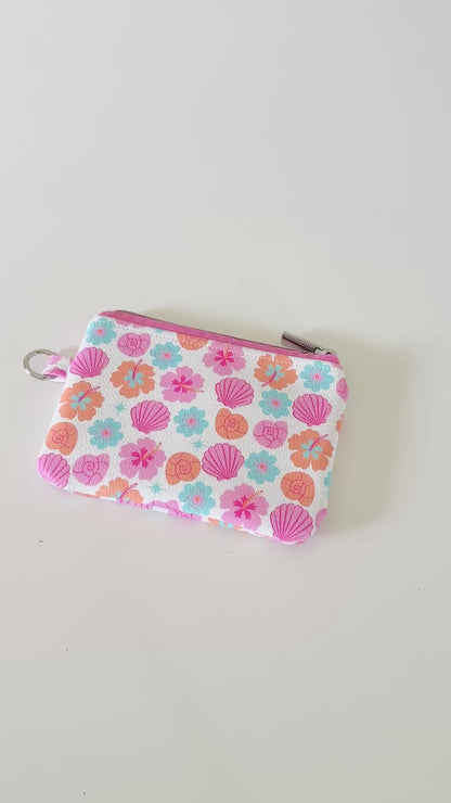 sea shell vegan leather coin purse with seashell pattern on a white background