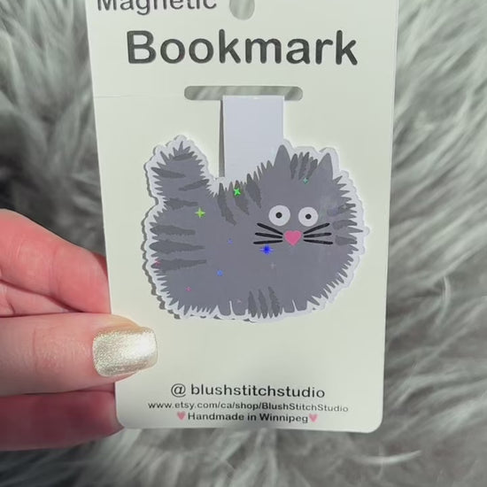 grey Cat-shaped magnetic bookmark on a Blush Stitch Studio card against a textured gray background