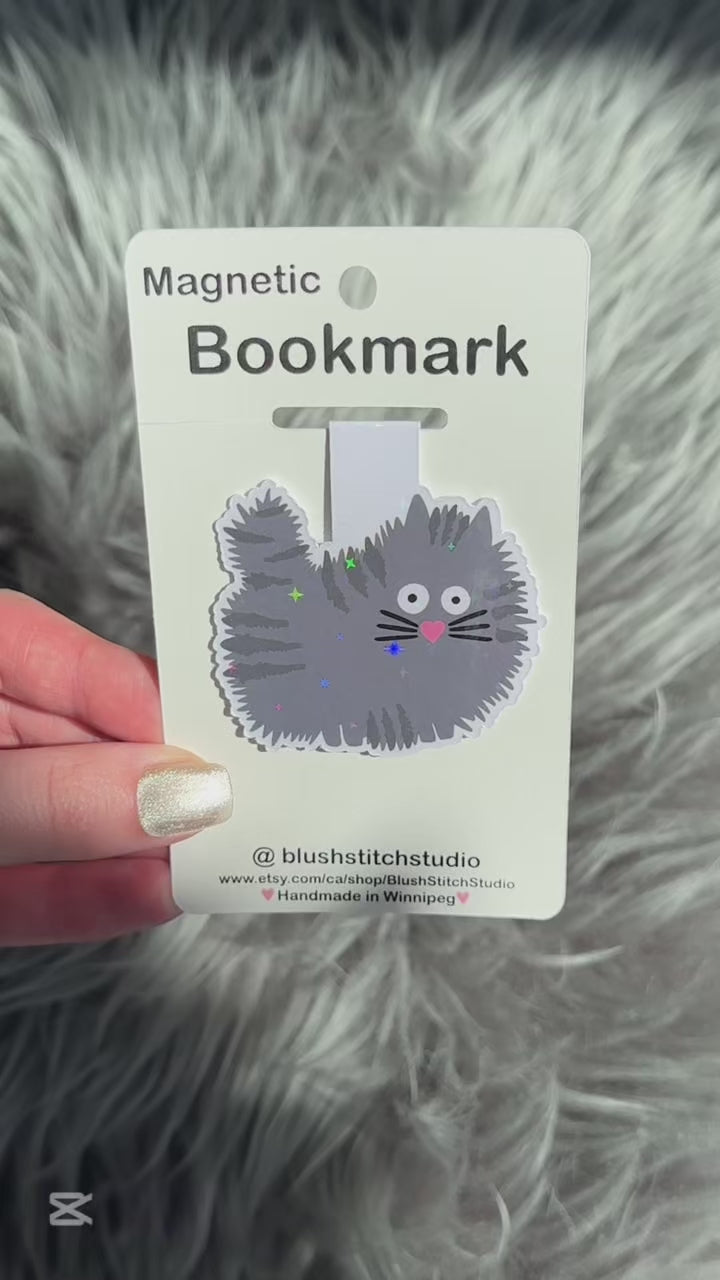 grey Cat-shaped magnetic bookmark on a Blush Stitch Studio card against a textured gray background