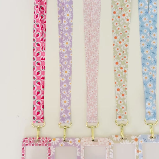 Set of colorful daisy floral  lanyards with various patterns on a white background