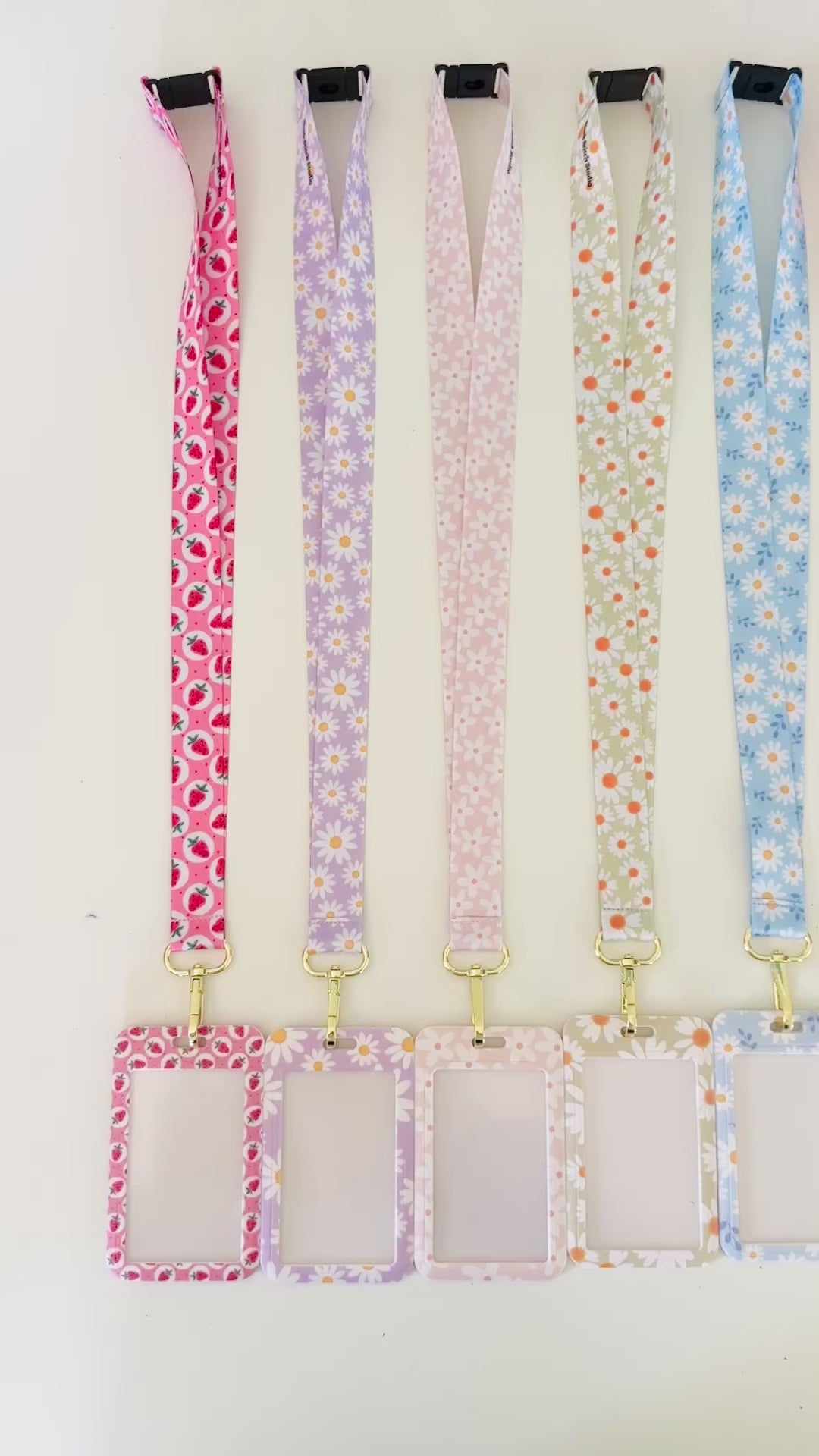 Set of colorful daisy floral  lanyards with various patterns on a white background