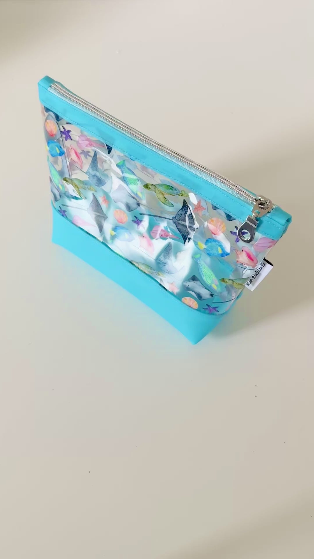 clear makeup bag with a tropical fish and stingray pattern 