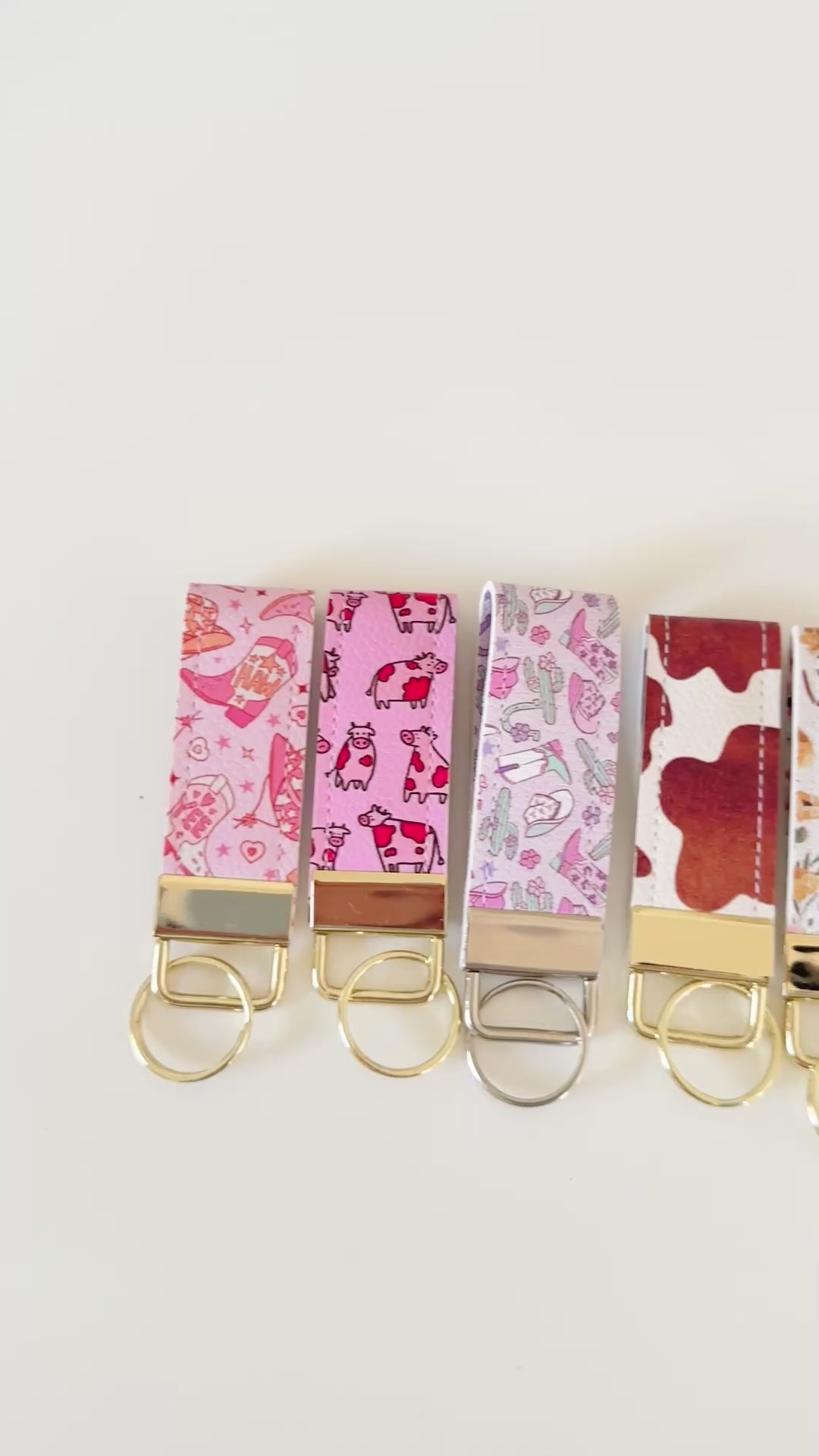 Western highland cow print and cowgirl pattern keychains made from vegan leather 