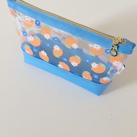 clear makeup bag with a blue and yellow lemon pattern