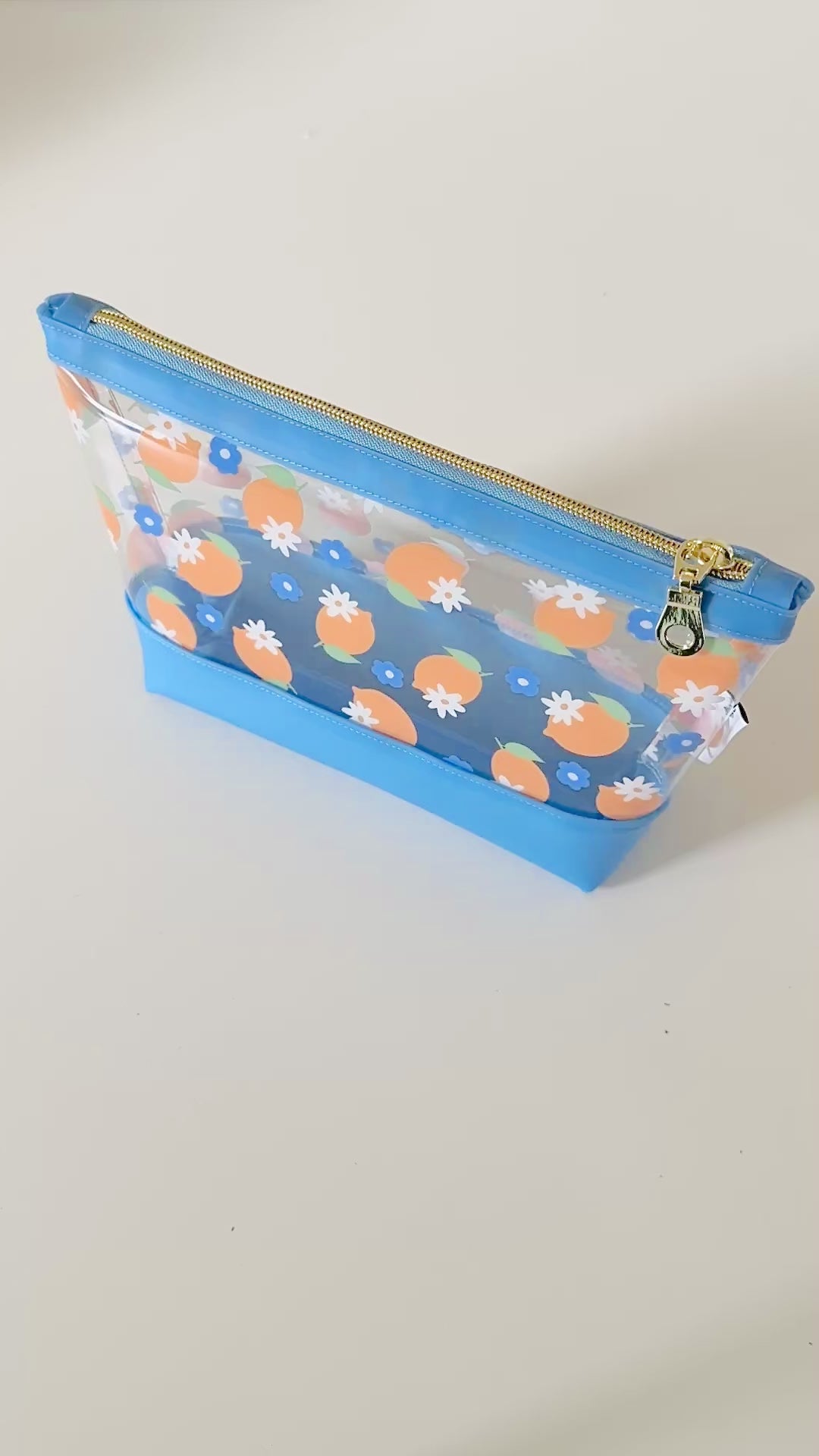 clear makeup bag with a blue and yellow lemon pattern