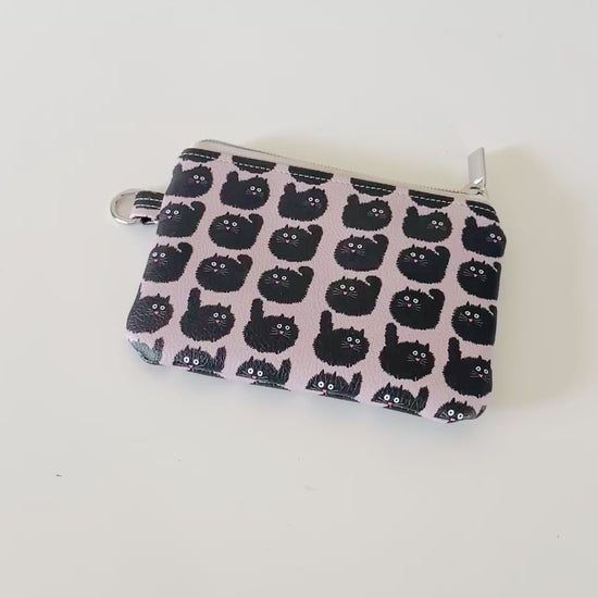 coin purse with a black cat pattern on a light background