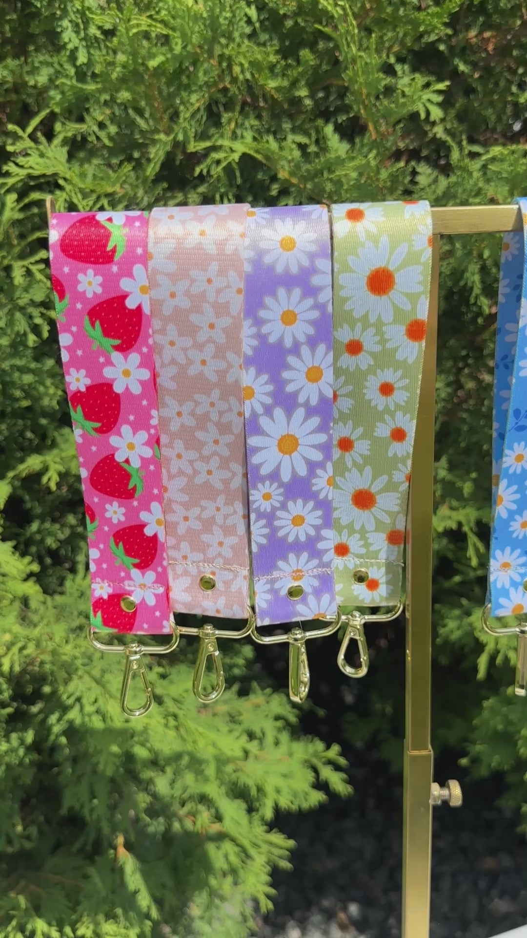Set of six floral patterned keychains wristlet on a white background