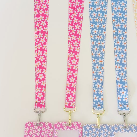 a video showing 4. daisy floral lanyards with the matching badge holders 