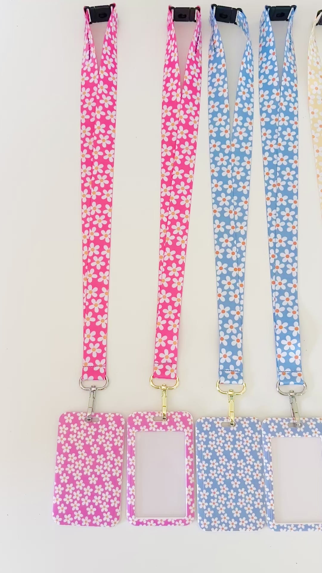 a video showing 4. daisy floral lanyards with the matching badge holders 