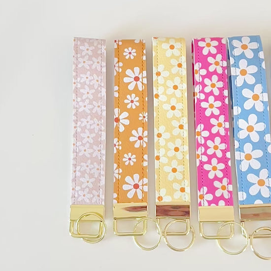Set of colorful floral key wristlets  on a white background