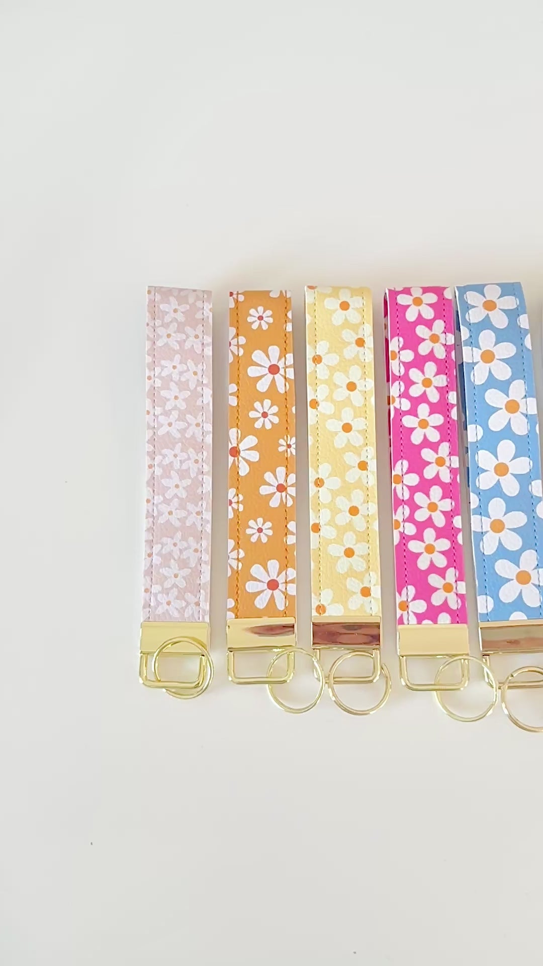 Set of colorful floral key wristlets  on a white background