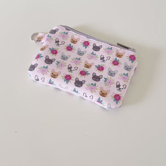 Small pouch with dog pattern on a white background